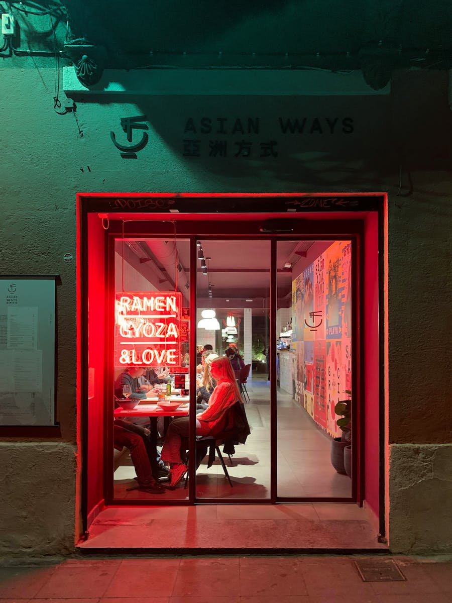 Asian restaurant in Barcelona with neon lights, offering a cozy indoor dining experience.